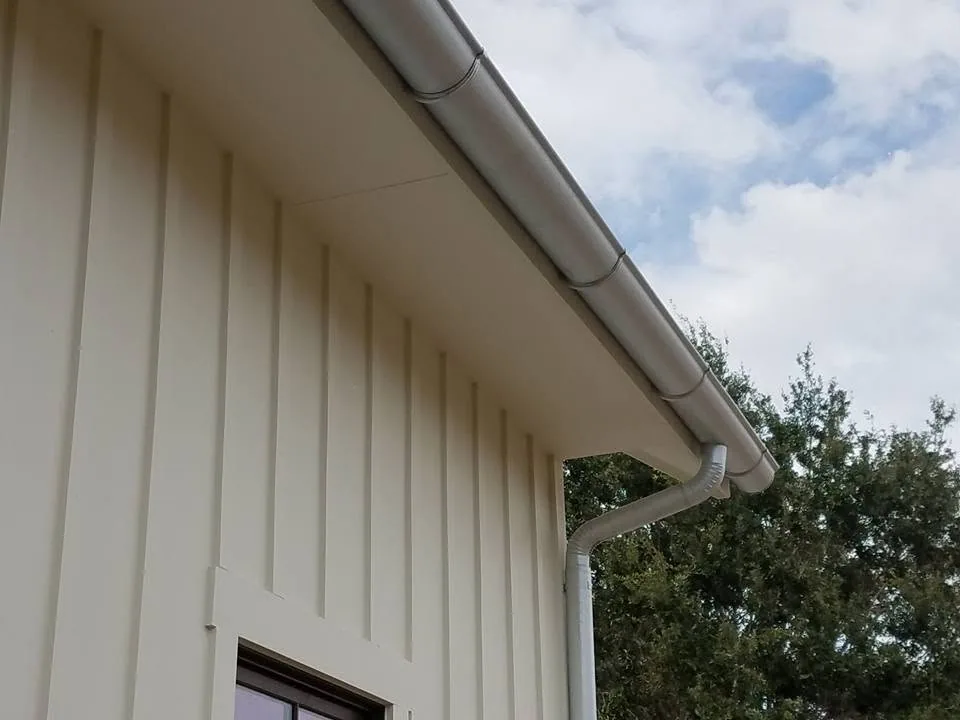 Galvalume half round gutter round downspout cream board batten, Sanford